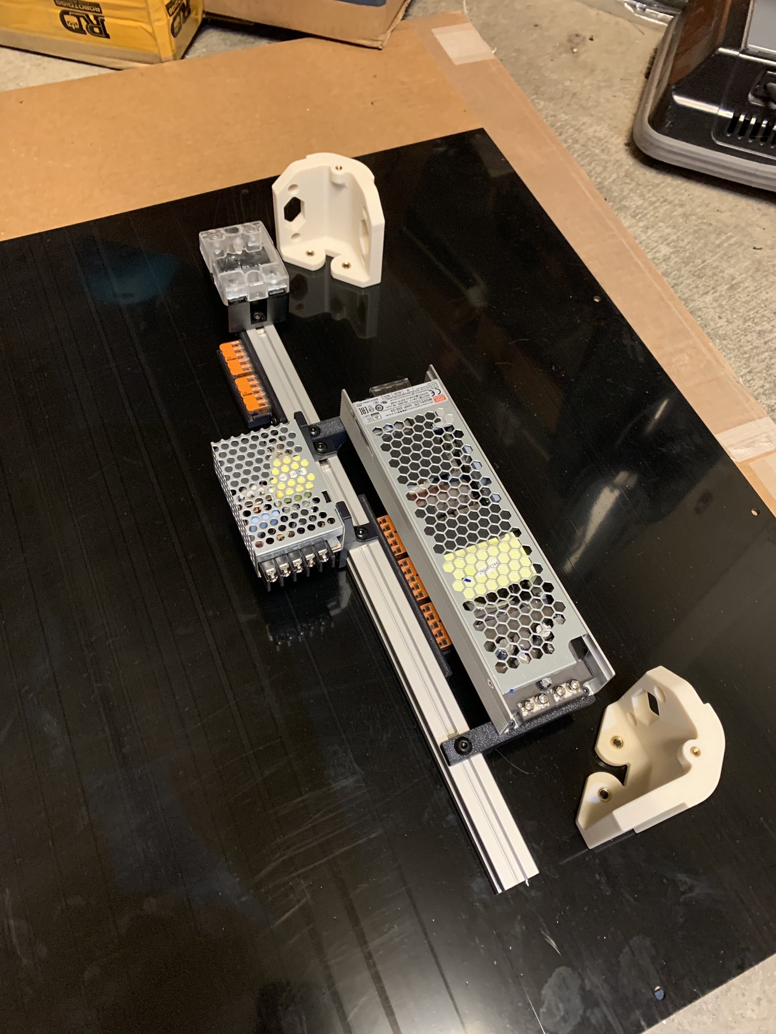 First electronics extrusion attached to back panel